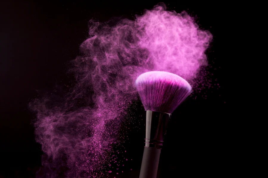 makeup-brush-with-purple-powder-dust-dark-background_23-2148209047